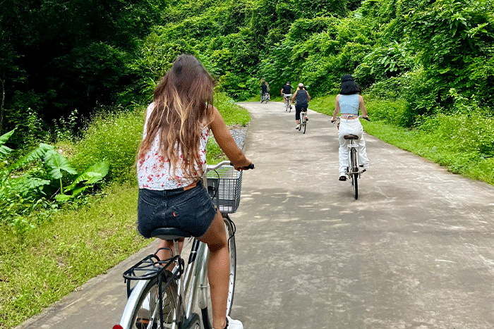 Guests cycling at Viet Hai fishing village